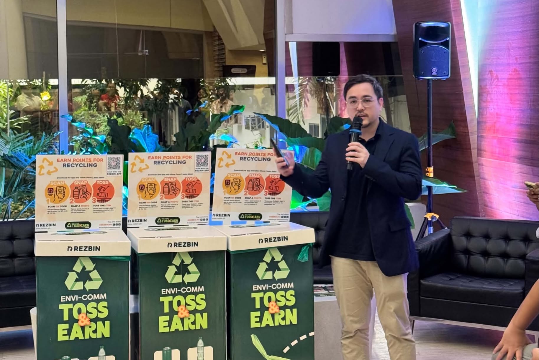 A speaker presents the Toss & Earn recycling stations at the Cebu launch